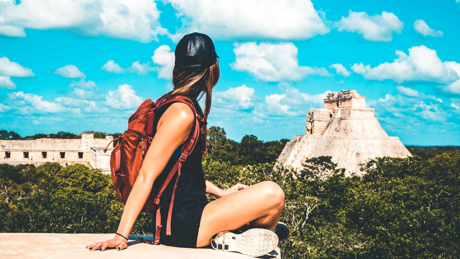 young-woman-traveling-with-backpack-in-mexico-uxmal